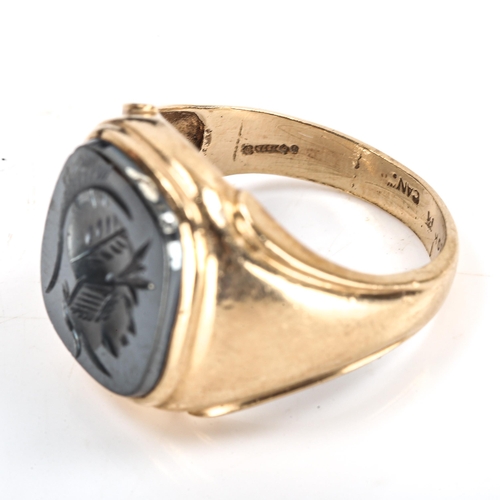 334 - A large 9ct gold haematite seal ring, intaglio carved with centurion profile, import hallmarks Londo... 