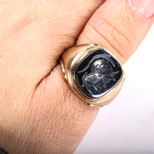 334 - A large 9ct gold haematite seal ring, intaglio carved with centurion profile, import hallmarks Londo... 