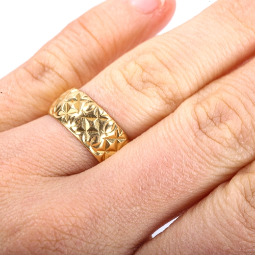 335 - A late 20th century 18ct gold wedding band ring, textured design, maker's marks S and W, hallmarks L... 