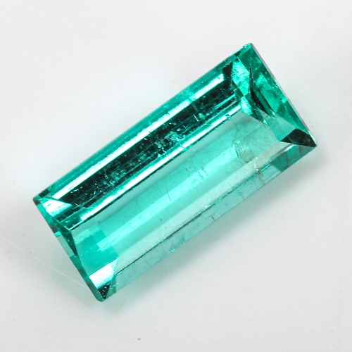 349 - 1.38ct unmounted rectangular step-cut emerald, measurements: 9.90mm x 4.64mm x 3.48mm, 0.28g