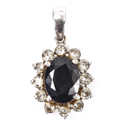 360 - A modern 18ct white gold sapphire and diamond cluster pendant, set with oval mixed-cut sapphire and ... 