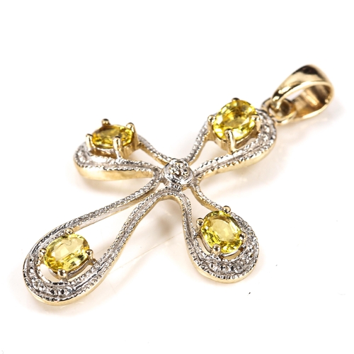 364 - A modern 9ct gold yellow sapphire and diamond stylised cross pendant, overall height 34mm, 1.8g