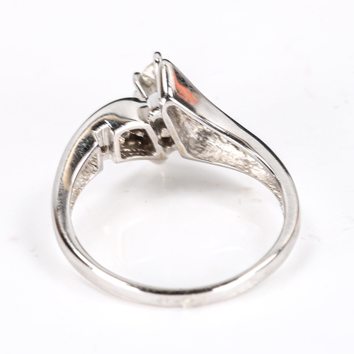 374 - A modern 14ct white gold marquise diamond solitaire ring, with crossover style baguette-cut diamond ... 