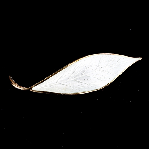 388 - DAVID ANDERSEN - a Vintage Norwegian vermeil sterling silver and white enamel leaf brooch, length 66... 