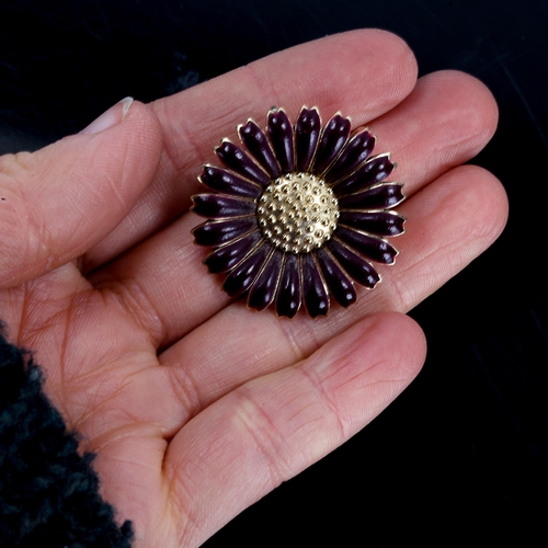 391 - KRANZ & ZIEGLER - a Danish vermeil sterling silver and maroon enamel daisy pattern pendant/brooch, d... 