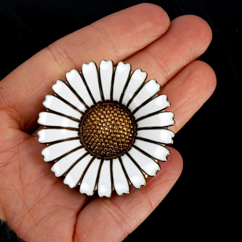 392 - BERNHARD HERTZ - a Vintage Danish vermeil sterling silver and white enamel daisy pattern brooch, dia... 