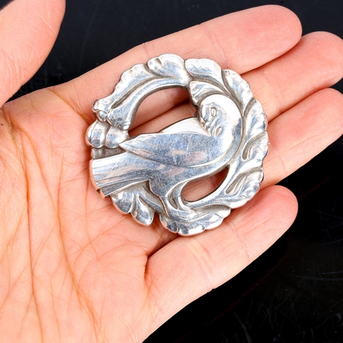 398 - GEORG JENSEN and WENDEL - a Vintage Danish sterling silver figural dove brooch, model no. 123, diame... 