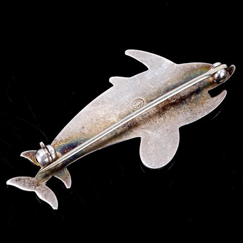 400 - GEORG JENSEN - a Vintage Danish sterling silver figural double dolphin brooch, designed by Arno Mali... 