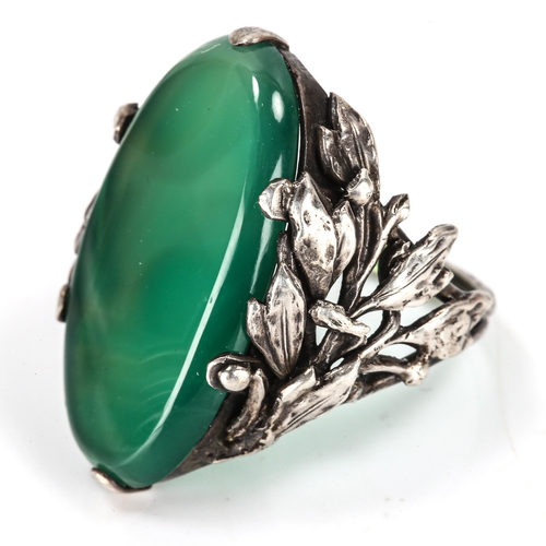 407 - An Arts and Crafts unmarked silver green agate dress ring, openwork floral shoulders, setting height... 