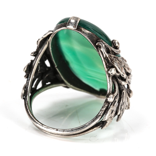 407 - An Arts and Crafts unmarked silver green agate dress ring, openwork floral shoulders, setting height... 