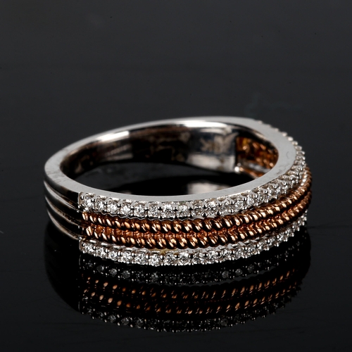 414 - A modern 9ct white and rose gold diamond half eternity ring, openwork rope twist centre flanked by r... 