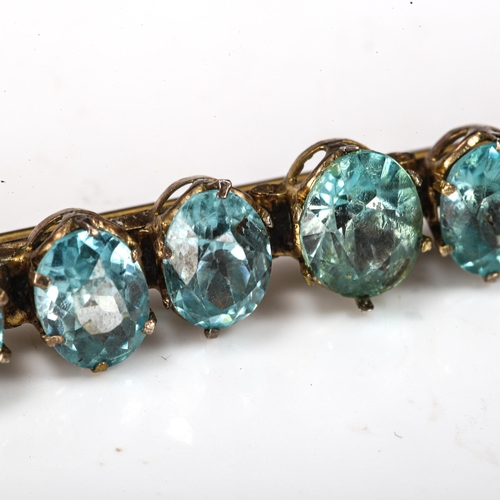 420 - A Vintage zircon line bar brooch, gilt-metal settings with oval mixed-cut zircon, largest length 8.5... 