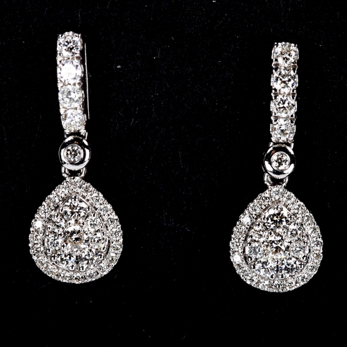 317 - A pair of modern 18ct white gold diamond cluster pear-drop stud earrings, set with modern round bril... 