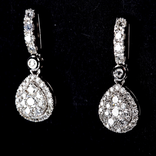 317 - A pair of modern 18ct white gold diamond cluster pear-drop stud earrings, set with modern round bril... 