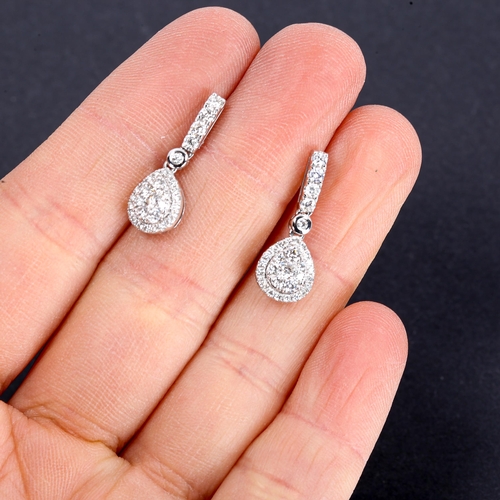 317 - A pair of modern 18ct white gold diamond cluster pear-drop stud earrings, set with modern round bril... 