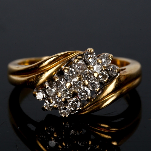 431 - A modern 18ct gold diamond cluster crossover ring, set with modern round brilliant-cut diamonds, tot... 