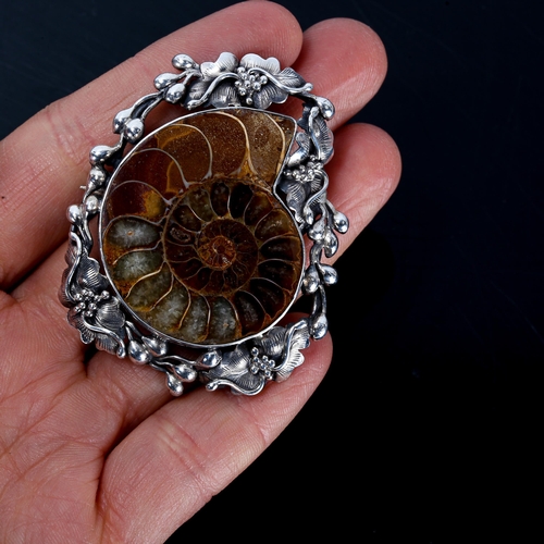 437 - A Scandinavian sterling silver ammonite fossil brooch, stylised floral surround, brooch height 53mm,... 