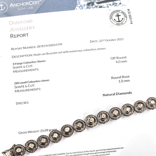 451 - A modern unmarked oxidised silver diamond cluster bracelet, set with table and rose-cut diamonds, to... 