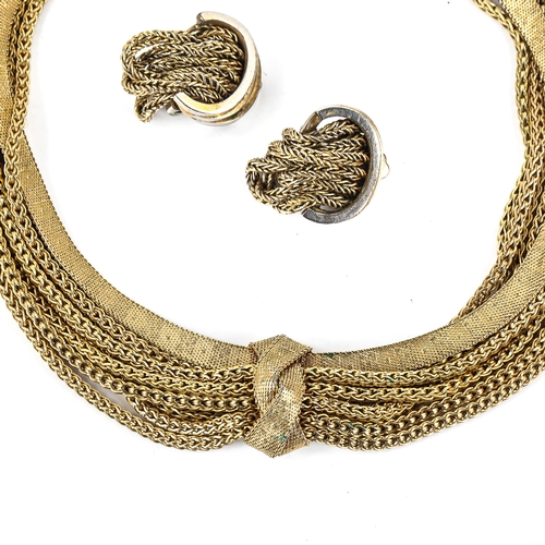 480 - CHRISTIAN DIOR - a Vintage gilt-metal multi-strand demi-parure, comprising necklace and pair of clip... 