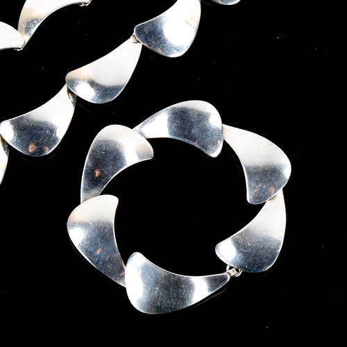 491 - ARNE JOHANSEN - a Vintage Danish stylised sterling silver sail matching necklace and bracelet set, l... 