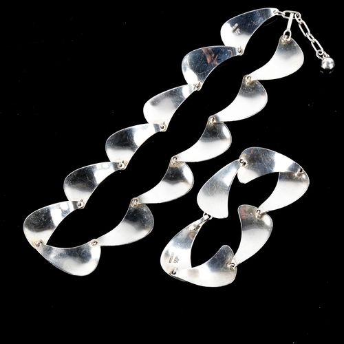 491 - ARNE JOHANSEN - a Vintage Danish stylised sterling silver sail matching necklace and bracelet set, l... 