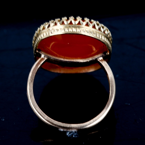 504 - A large carnelian seal ring, intaglio carved with Greyhound emblem and initials MB, setting height 2... 