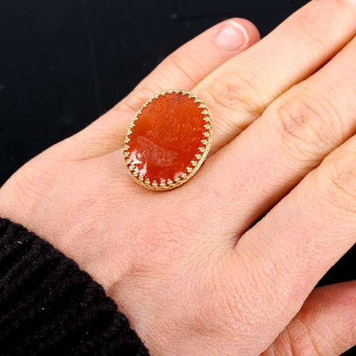 504 - A large carnelian seal ring, intaglio carved with Greyhound emblem and initials MB, setting height 2... 