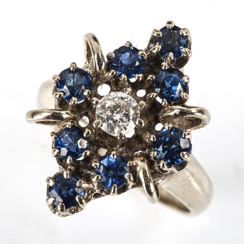 506 - A late 20th century 14ct white gold sapphire and diamond marquise cluster ring, set with modern roun... 