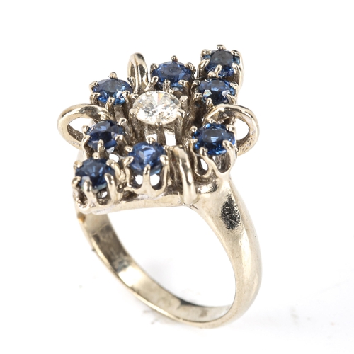 506 - A late 20th century 14ct white gold sapphire and diamond marquise cluster ring, set with modern roun... 