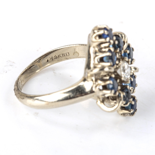 506 - A late 20th century 14ct white gold sapphire and diamond marquise cluster ring, set with modern roun... 