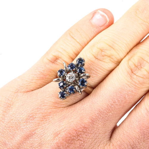 506 - A late 20th century 14ct white gold sapphire and diamond marquise cluster ring, set with modern roun... 