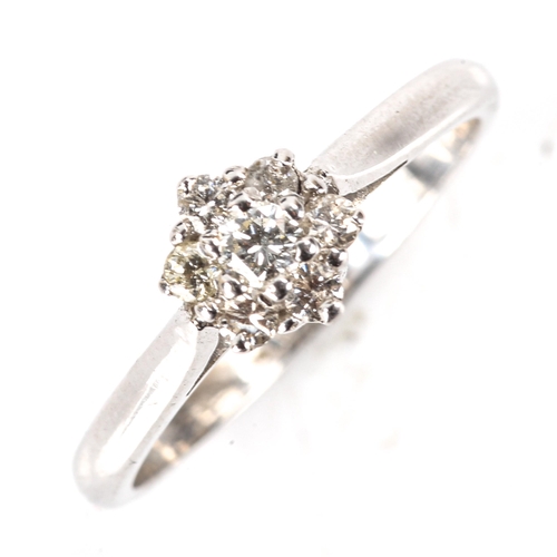 508 - A modern platinum diamond cluster flowerhead ring, set with modern round brilliant-cut diamonds, tot... 