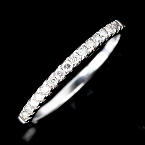 512 - An 18ct white gold diamond half eternity ring, set with modern round brilliant-cut diamonds, total d... 