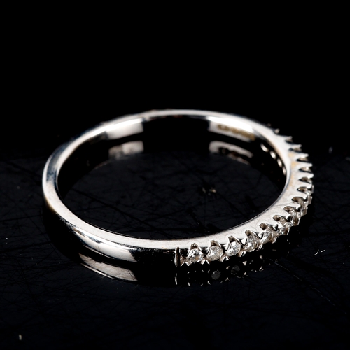 512 - An 18ct white gold diamond half eternity ring, set with modern round brilliant-cut diamonds, total d... 