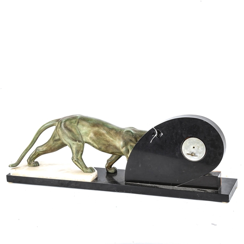 1262 - An large Art deco marble faced clock with a bronzed spelter panther figure, length 77cm