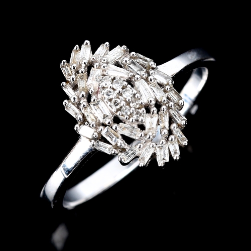 513 - A modern 9ct white gold diamond marquise cluster ring, set with baguette and single-cut diamonds, to... 