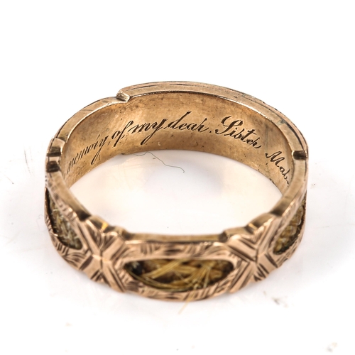 516 - A Victorian 9ct gold woven hair memorial ring, with openwork panels displaying hair with internal in... 