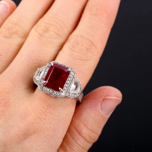 519 - A modern sterling silver ruby and white topaz dress ring, setting height 15.9mm, size Q, 8.9g