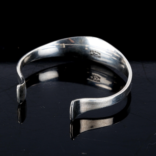 531 - RUDOLF ANDRESEN - a Vintage Danish modernist sterling silver plain form torque bangle, setting heigh... 