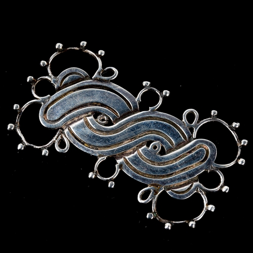 534 - A large mid-century Mexican silver brooch, by William Spratling of Taxco, circa 1940, length 66.8mm,... 