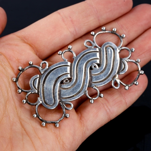 534 - A large mid-century Mexican silver brooch, by William Spratling of Taxco, circa 1940, length 66.8mm,... 