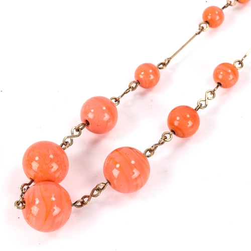 541 - A polished ceramic bead necklace, on wire chain, necklace length 40cm, 21.9g