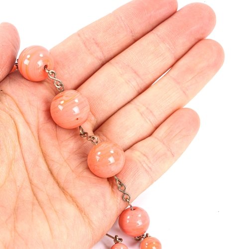 541 - A polished ceramic bead necklace, on wire chain, necklace length 40cm, 21.9g