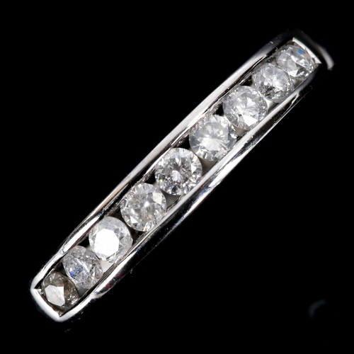 546 - A modern 18ct white gold diamond half eternity ring, set with modern round brilliant-cut diamonds, t... 