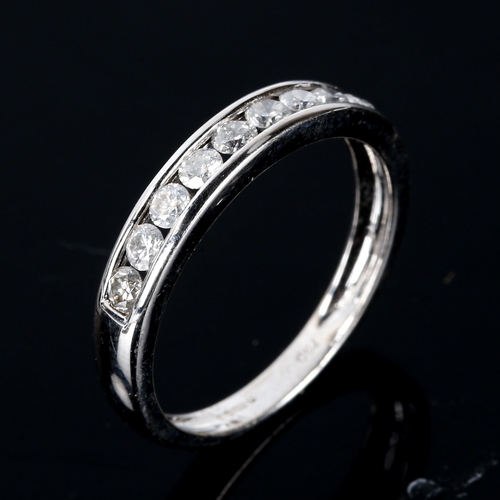 546 - A modern 18ct white gold diamond half eternity ring, set with modern round brilliant-cut diamonds, t... 