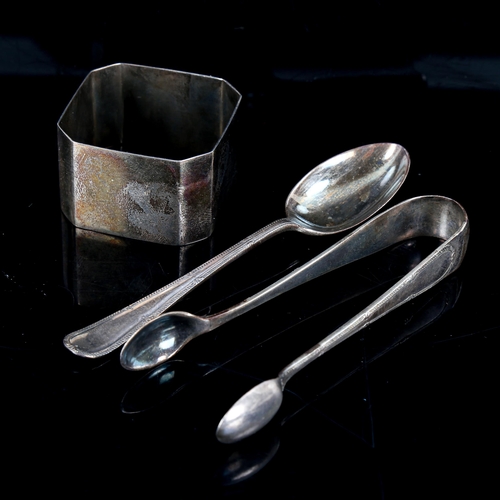 551 - A cased set of silver teaspoons and sugar tongs, and a silver napkin ring, 4oz total