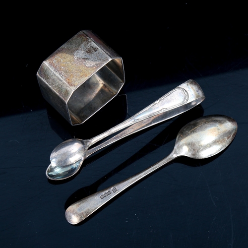 551 - A cased set of silver teaspoons and sugar tongs, and a silver napkin ring, 4oz total