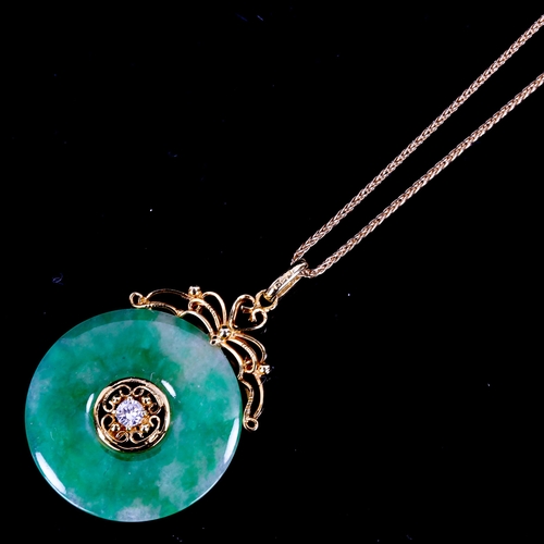 553 - A fine Chinese 18ct gold diamond and jade disc pendant necklace, set with 0.08ct modern round brilli... 