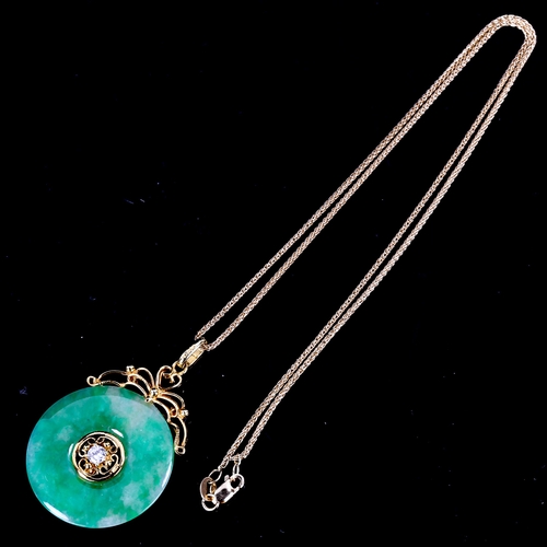 553 - A fine Chinese 18ct gold diamond and jade disc pendant necklace, set with 0.08ct modern round brilli... 