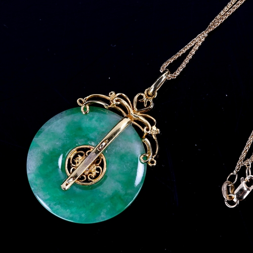 553 - A fine Chinese 18ct gold diamond and jade disc pendant necklace, set with 0.08ct modern round brilli... 